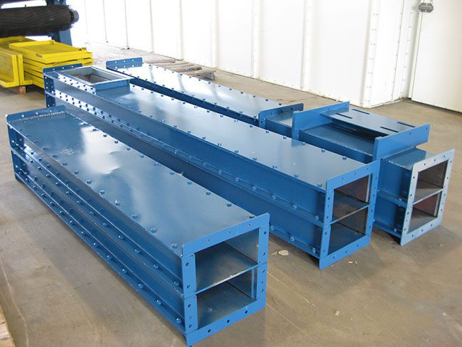 structural steel sections ready for assembly.