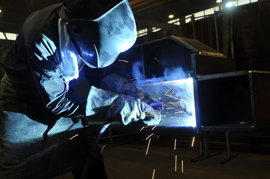 Welding Operator working on steel beam.