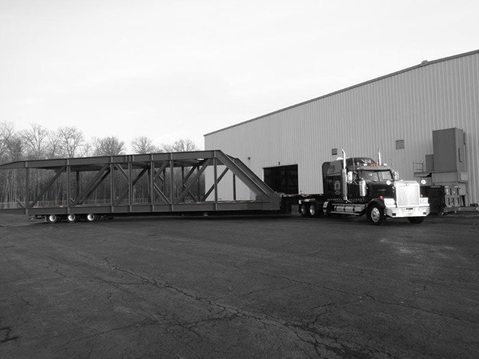 Semi Truck with structure loaded up and ready to deliver.