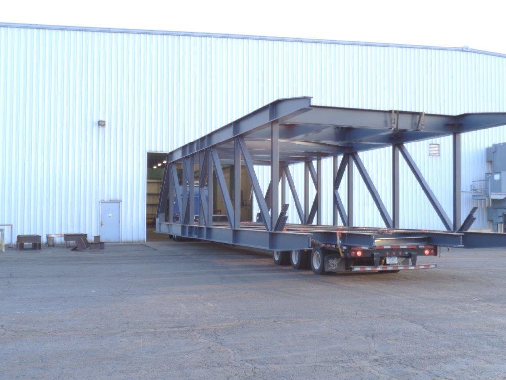 Large replacement boom leaving the shop with barely enough room to clear the top of the door frame due to the large size of this project.